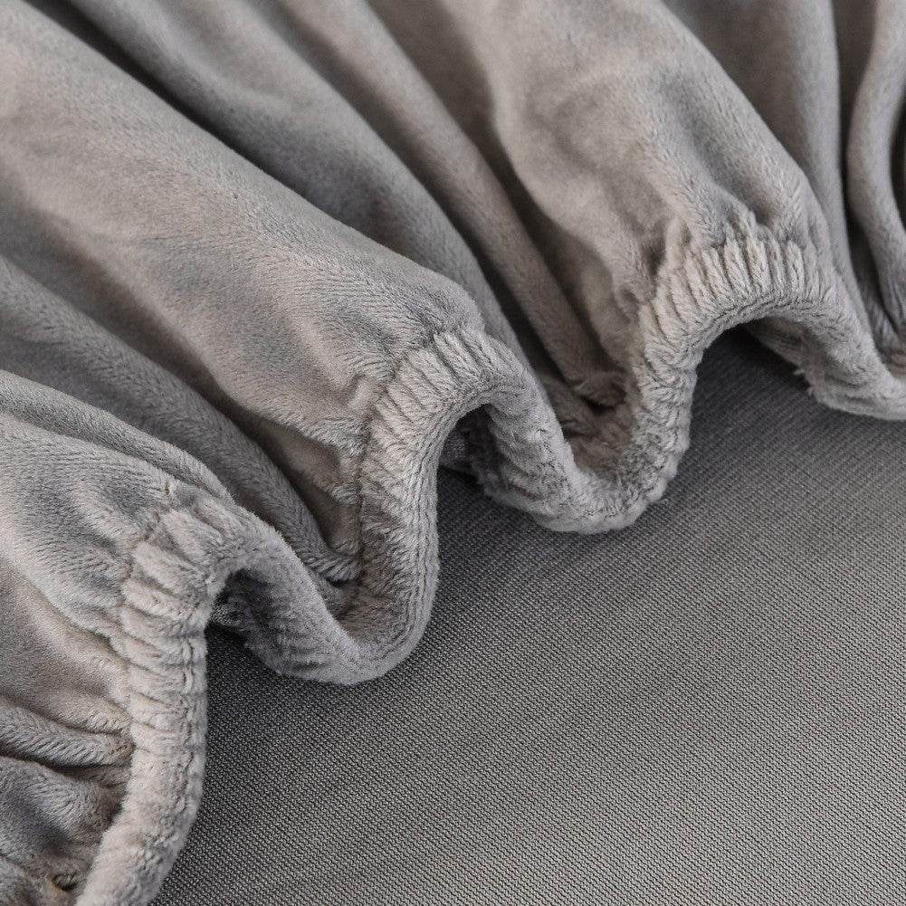 Close-up of textured plush fabric with soft folds, showcasing the cozy feel and stretchable quality of the Cozee Ultra Soft Plush Slipcover